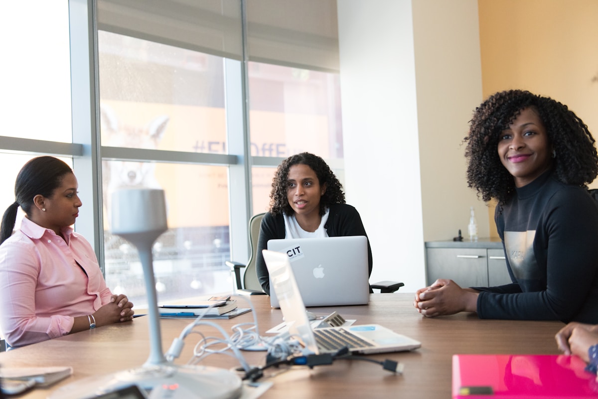 A team in conversation around a meeting table