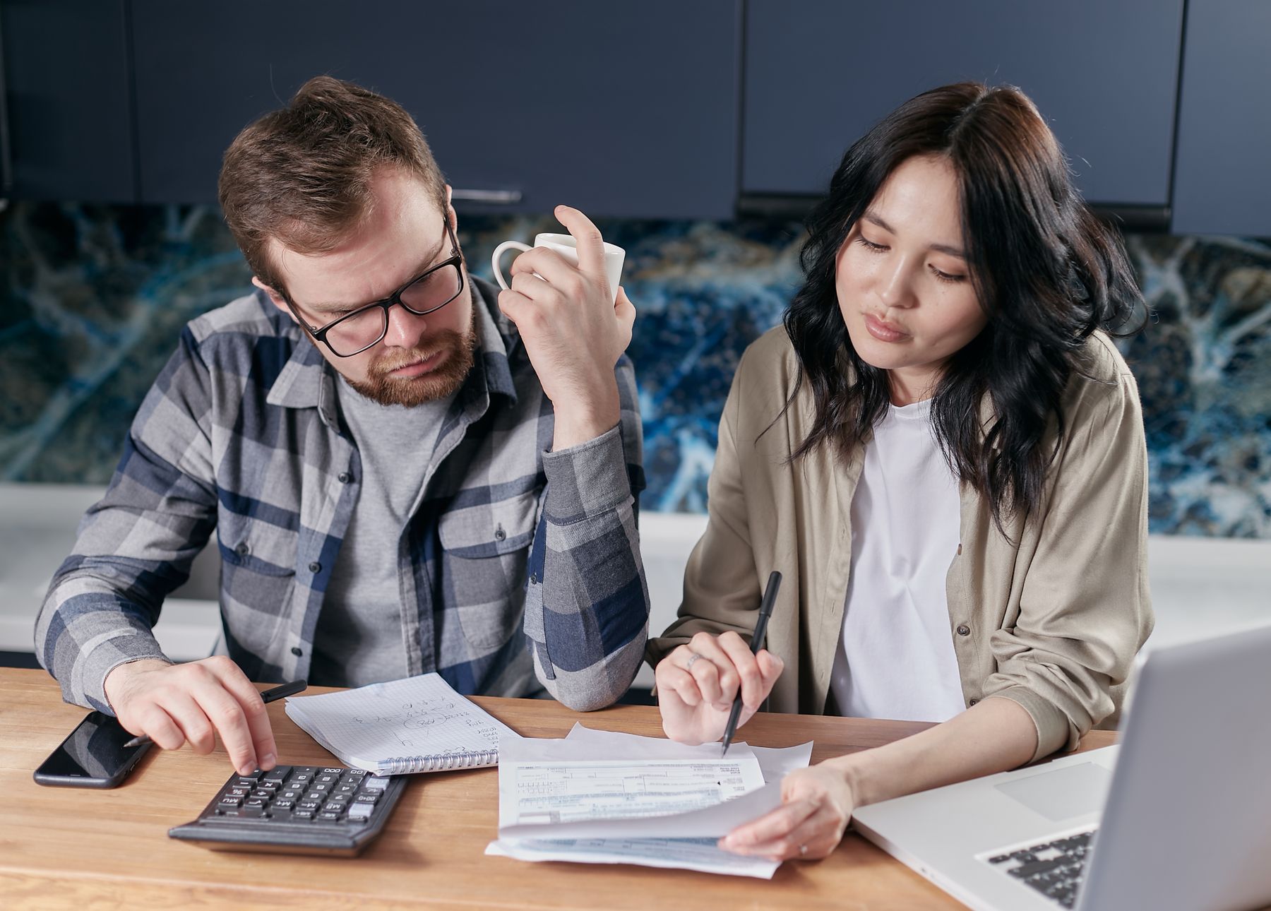 A couple reviewing their household budget together