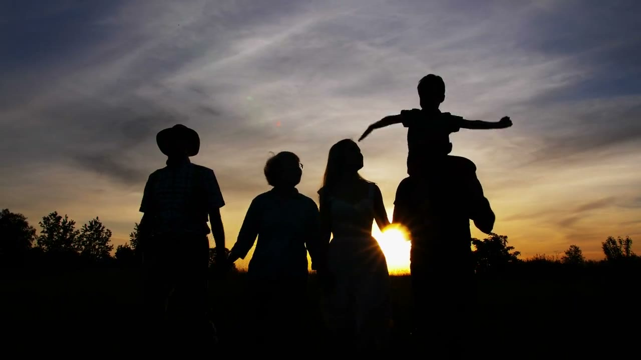 A family spending time together at sunset